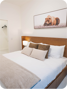 Dark wood console table with tall blue vases (2)