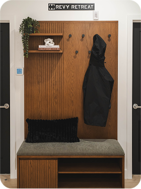Dark wood console table with tall blue vases
